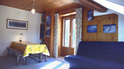 Studio living room with balcony access....